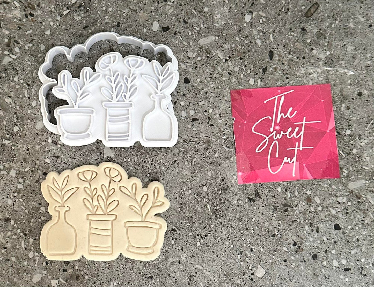 Three plants in vases stamp and cutter