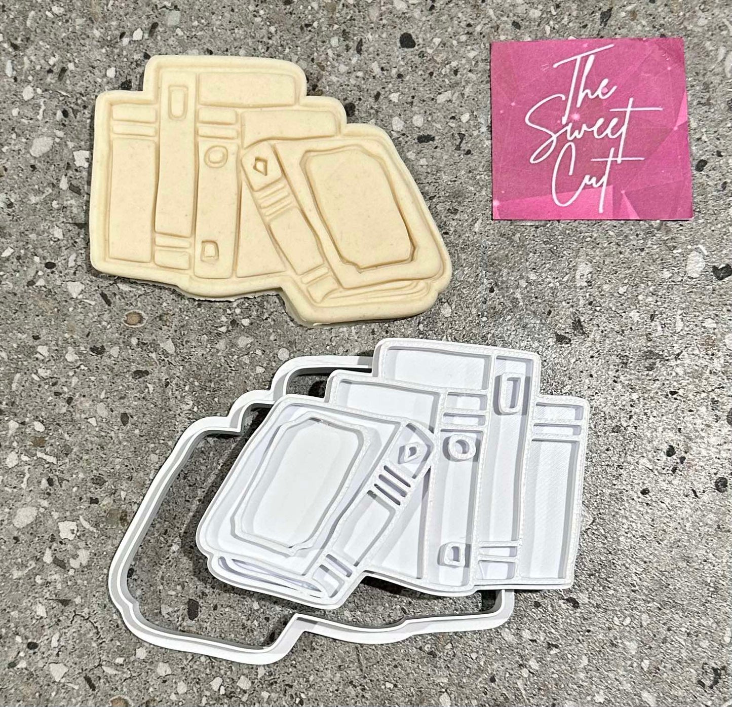 Stack of books stamp and cutter