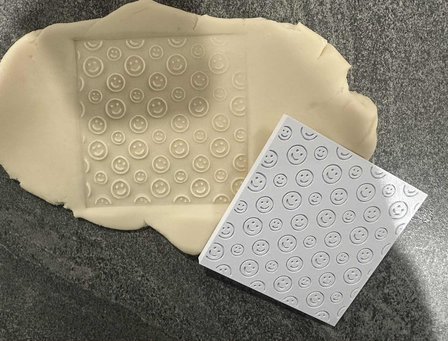 Smiley face debosser plate