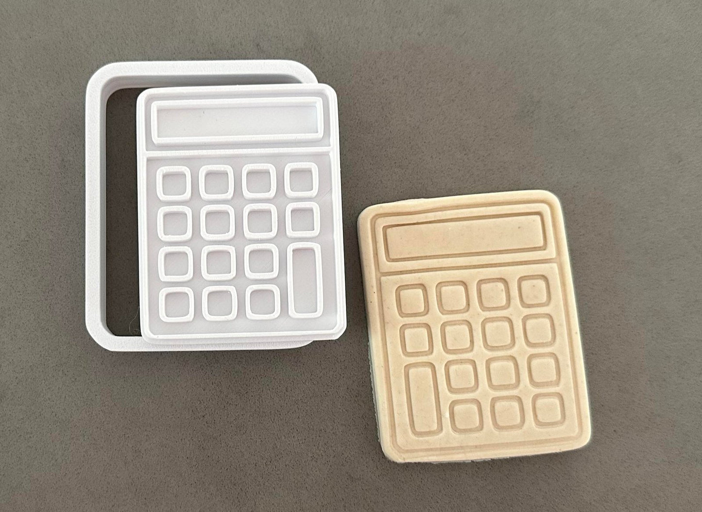 Calculator stamp and cutter