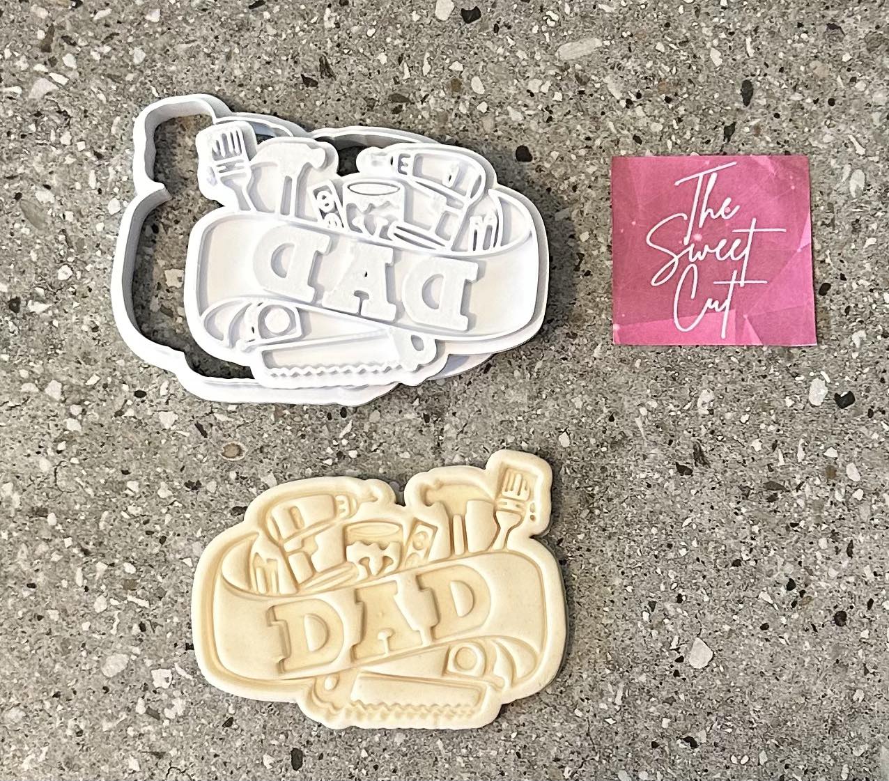 Dad with objects around stamp and cutter