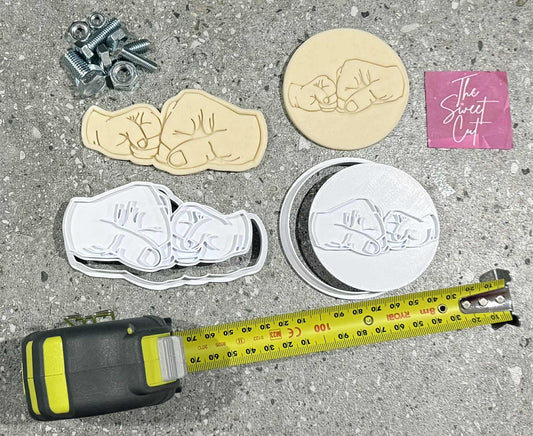Fist pump stamp and cutter