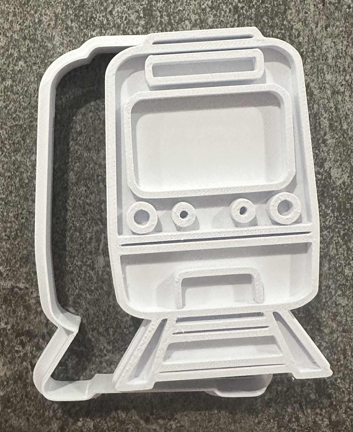 Front on train stamp and cutter